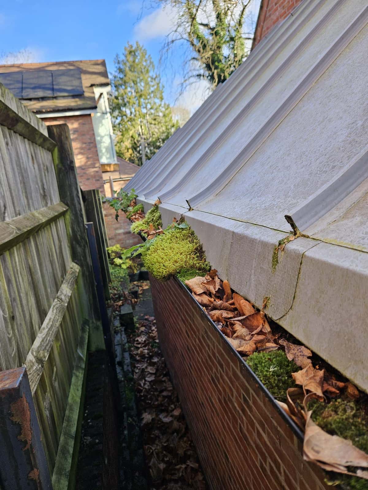 Before and after gutter clearing, moss and leaves removed, in Leicestershire